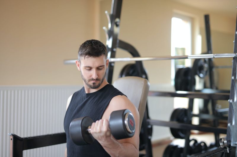 man lifting weights