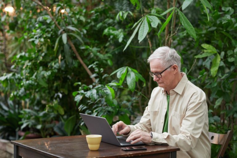 elderly man on laptop