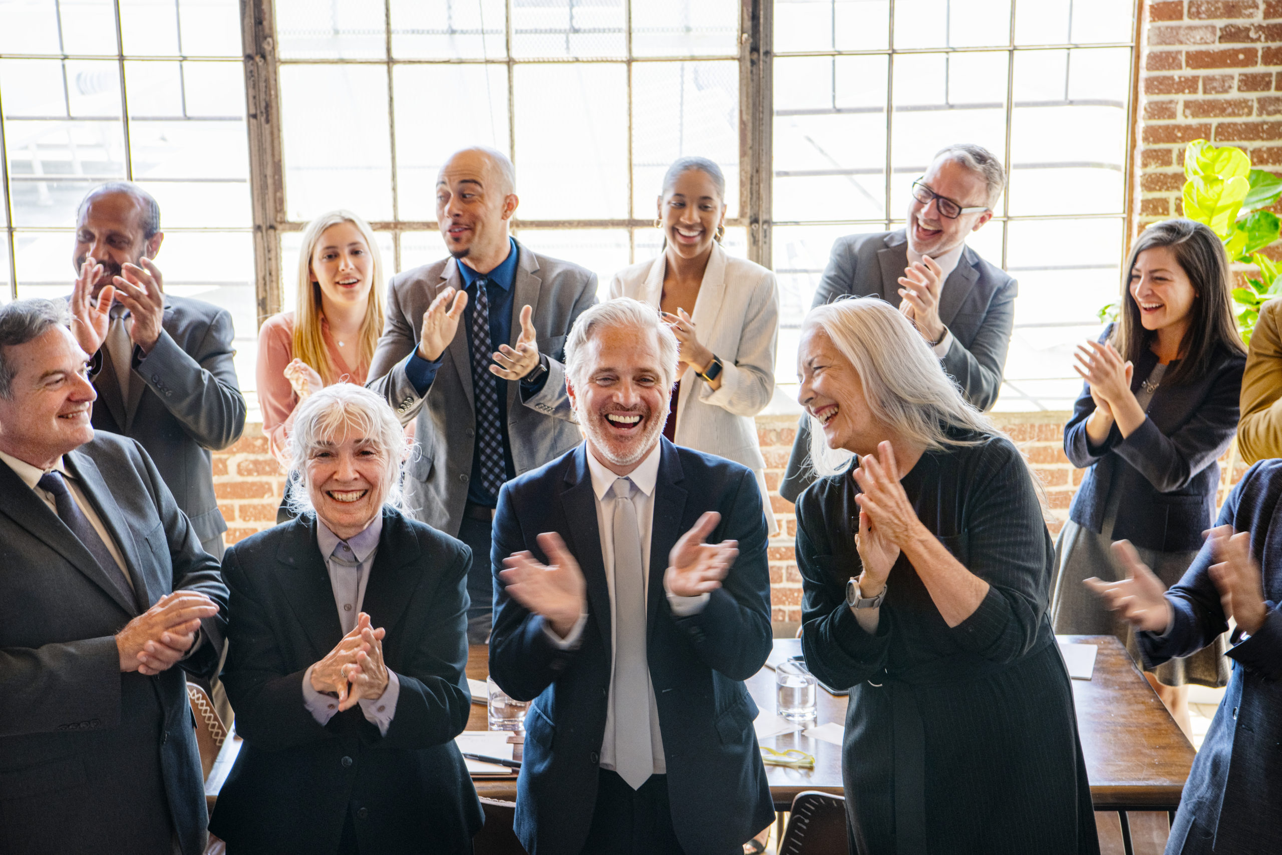 a group of diverse businesspeople applauding