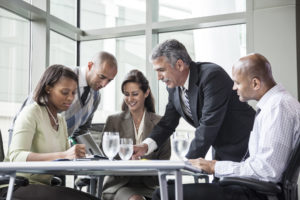 Multi-ethnic group of businesspeople in a meeting at a conference table