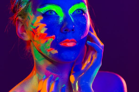 Woman Portrait painted with UV makeup color